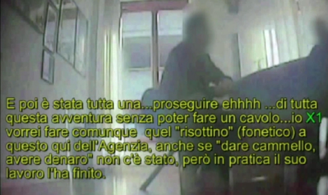 Un fermo immagine tratto da un video della Guardia di Finanza mostra una intercettazione ambientale