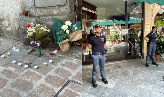 I fiori lasciati all’esterno del negozio di Davide Gorla a Busto Arsizio (foto Domenico Ghiotto/BLITZ)